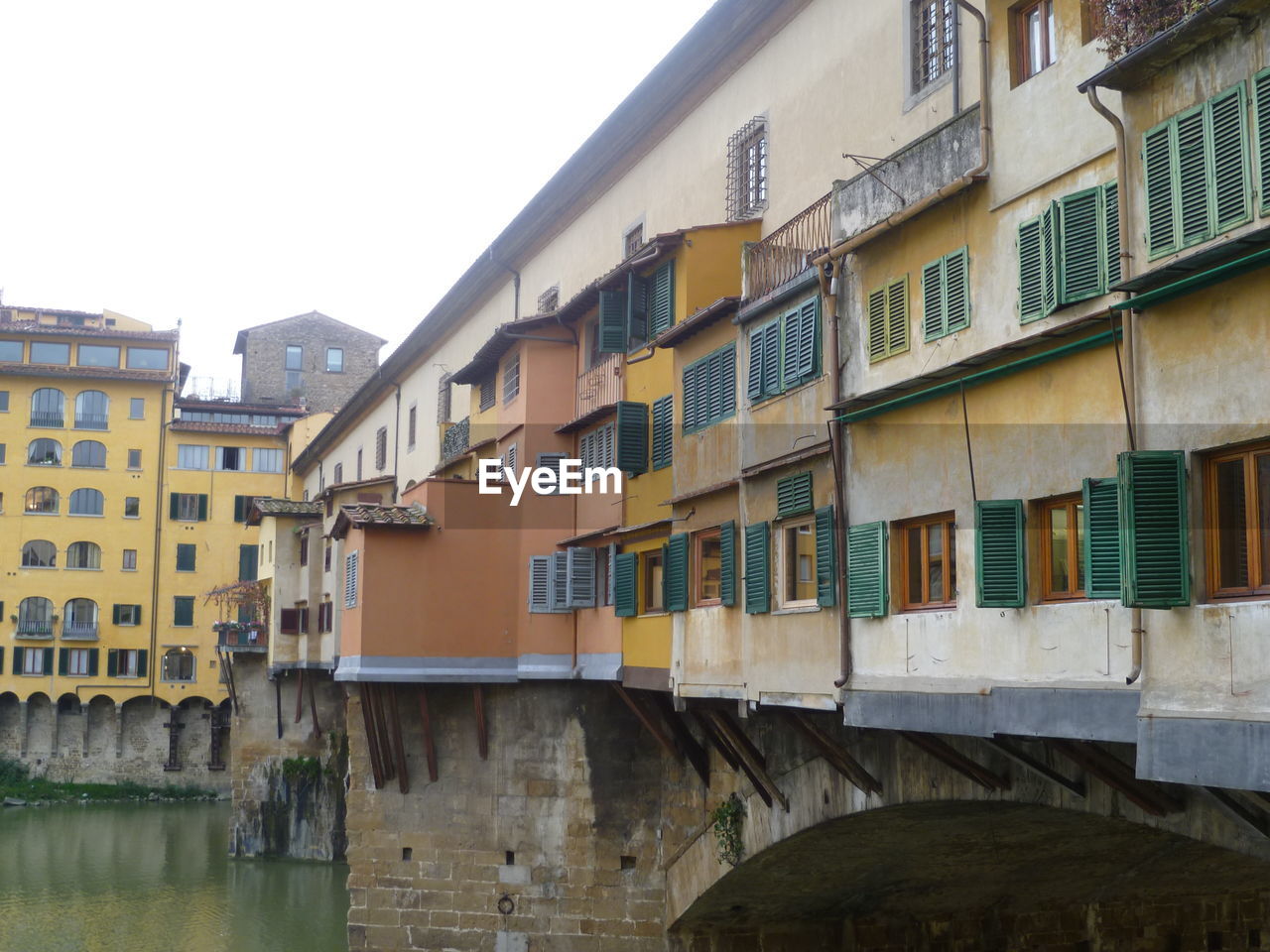 Houses and ponte vecchio over arno river