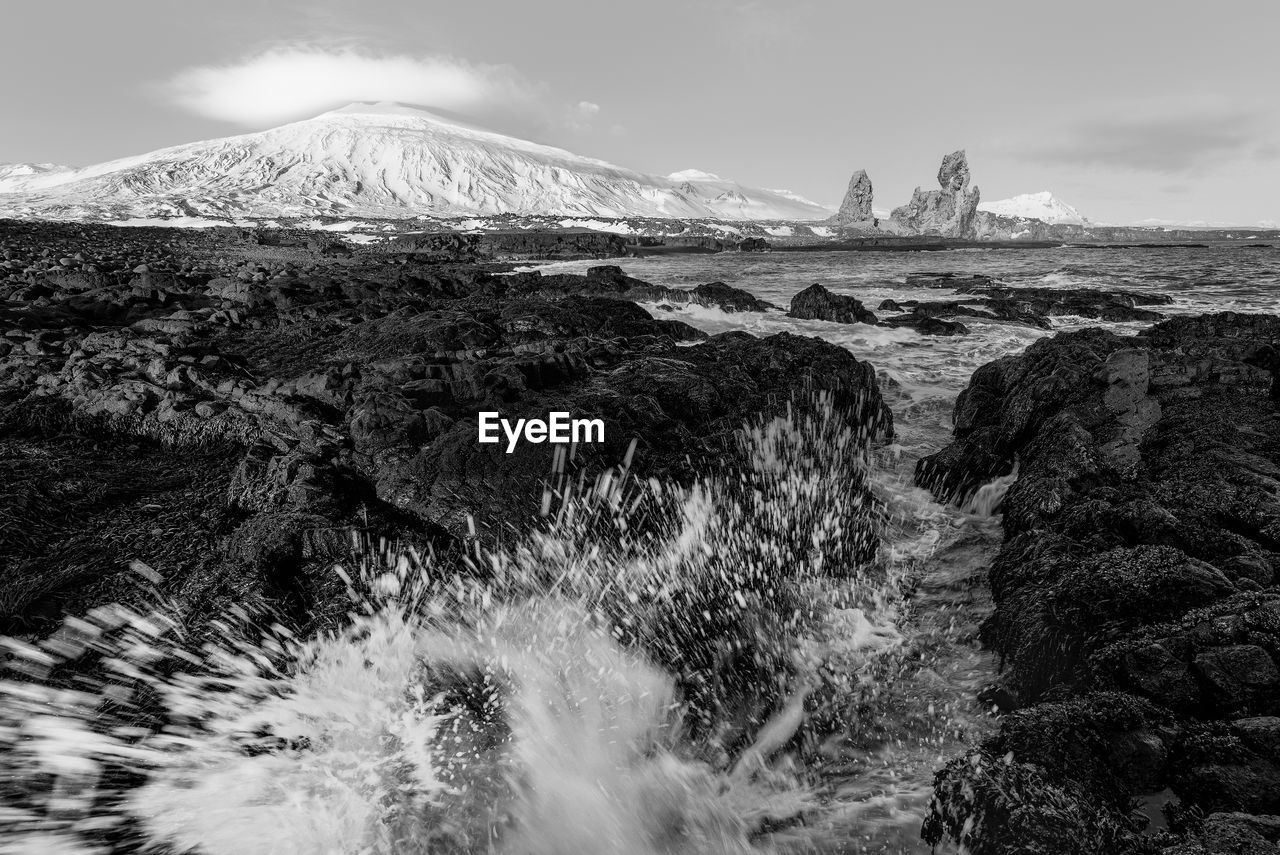 Aerial view of landscape with mountain in background