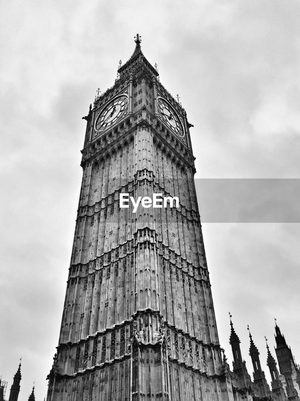 Low angle view of big ben against cloudy sky