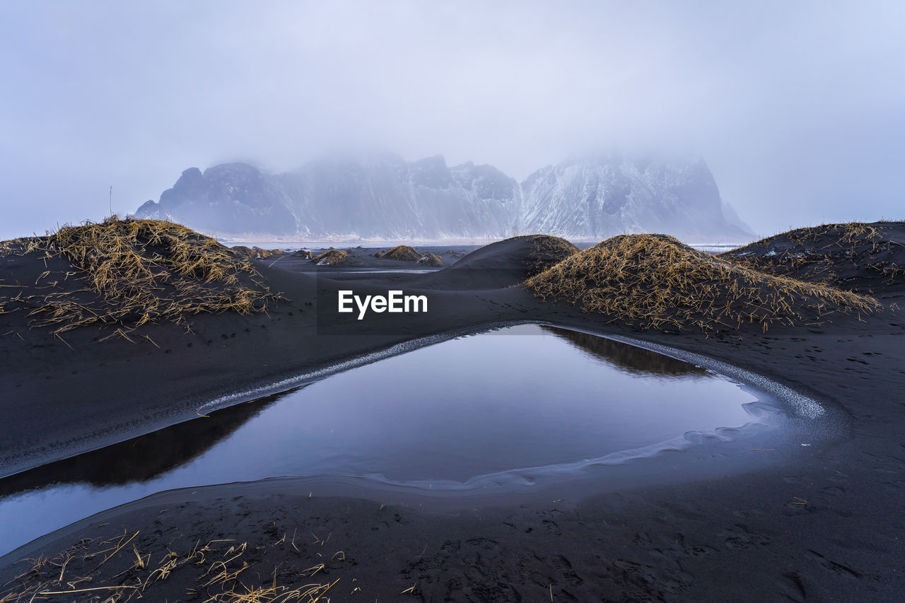 Amazing view of black sand stockness beach and vestrahorn mountain in background in iceland