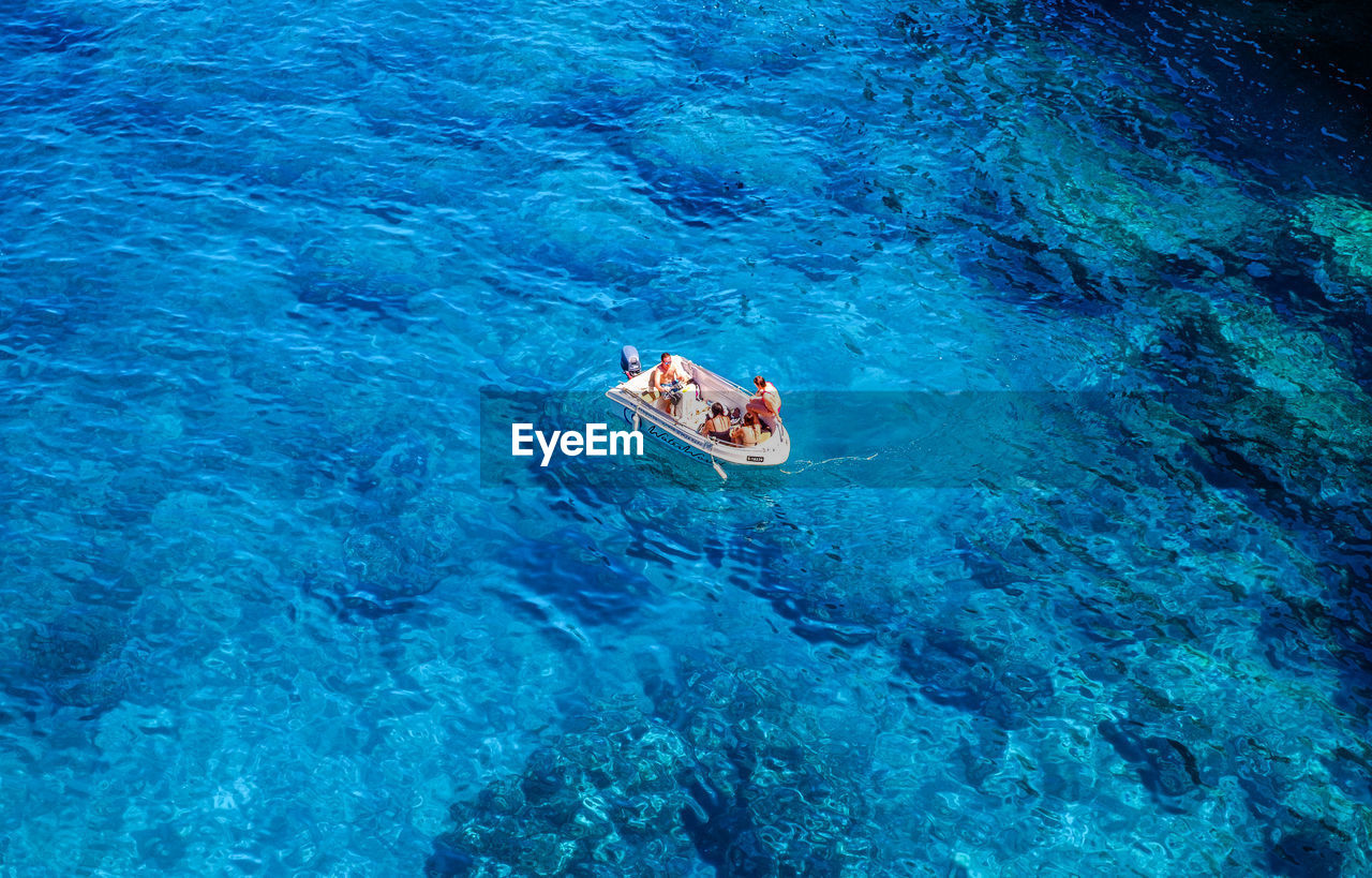 HIGH ANGLE VIEW OF PEOPLE ON SHORE