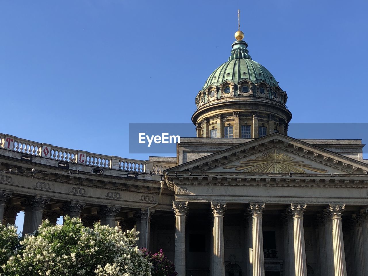 Low angle view of building against clear blue sky