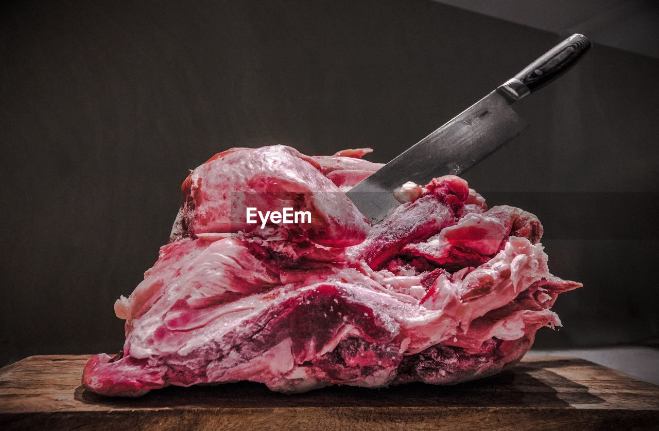 Close-up of beef on chopping board