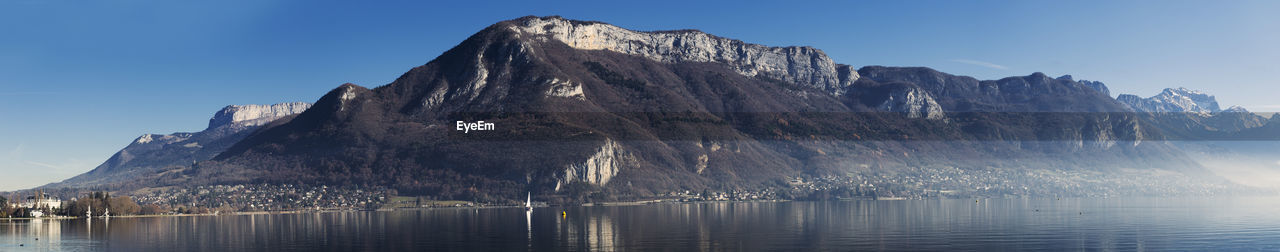 Panorama of lake annecy and mountains in france, on a sunny winter morning