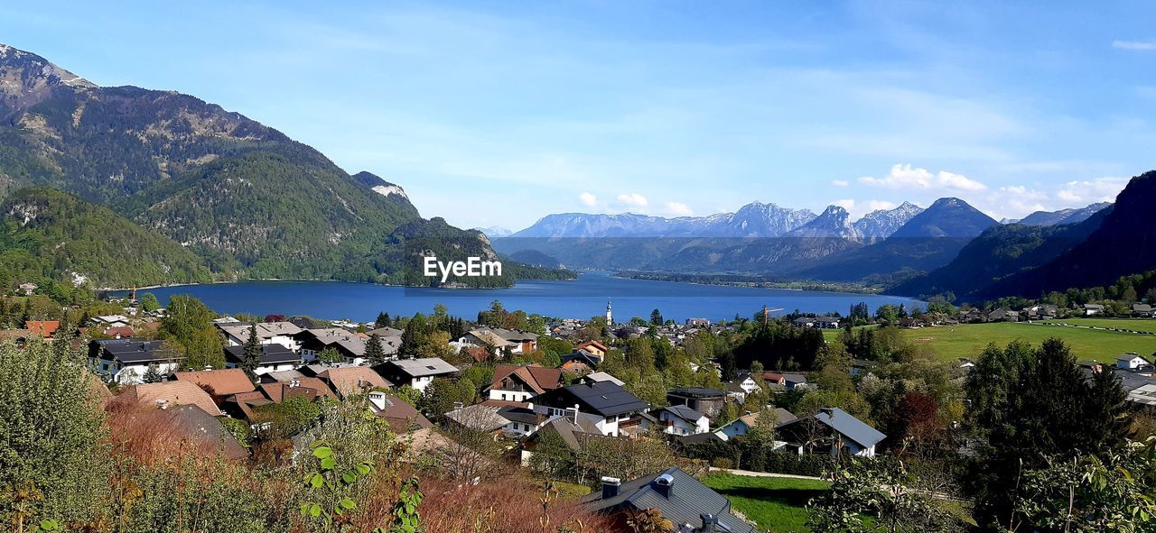 Panoramic shot of townscape by sea against sky