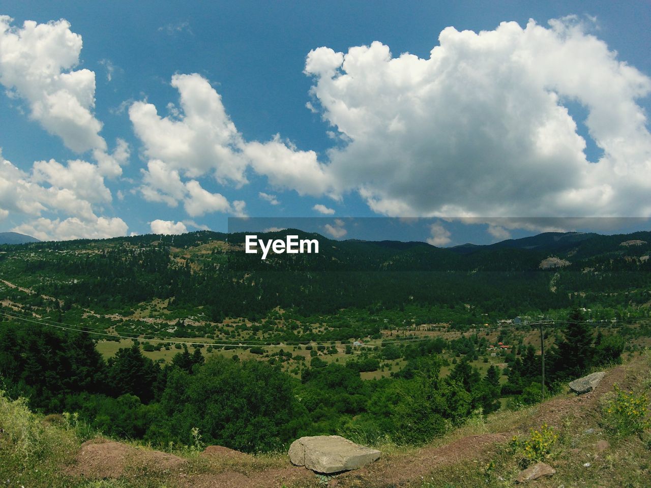 Scenic view of landscape against cloudy sky