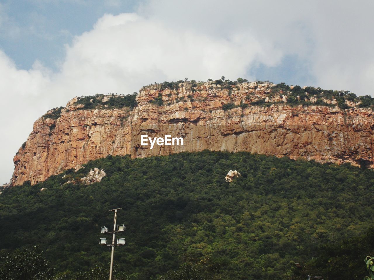 Low angle view of rock formations against sky