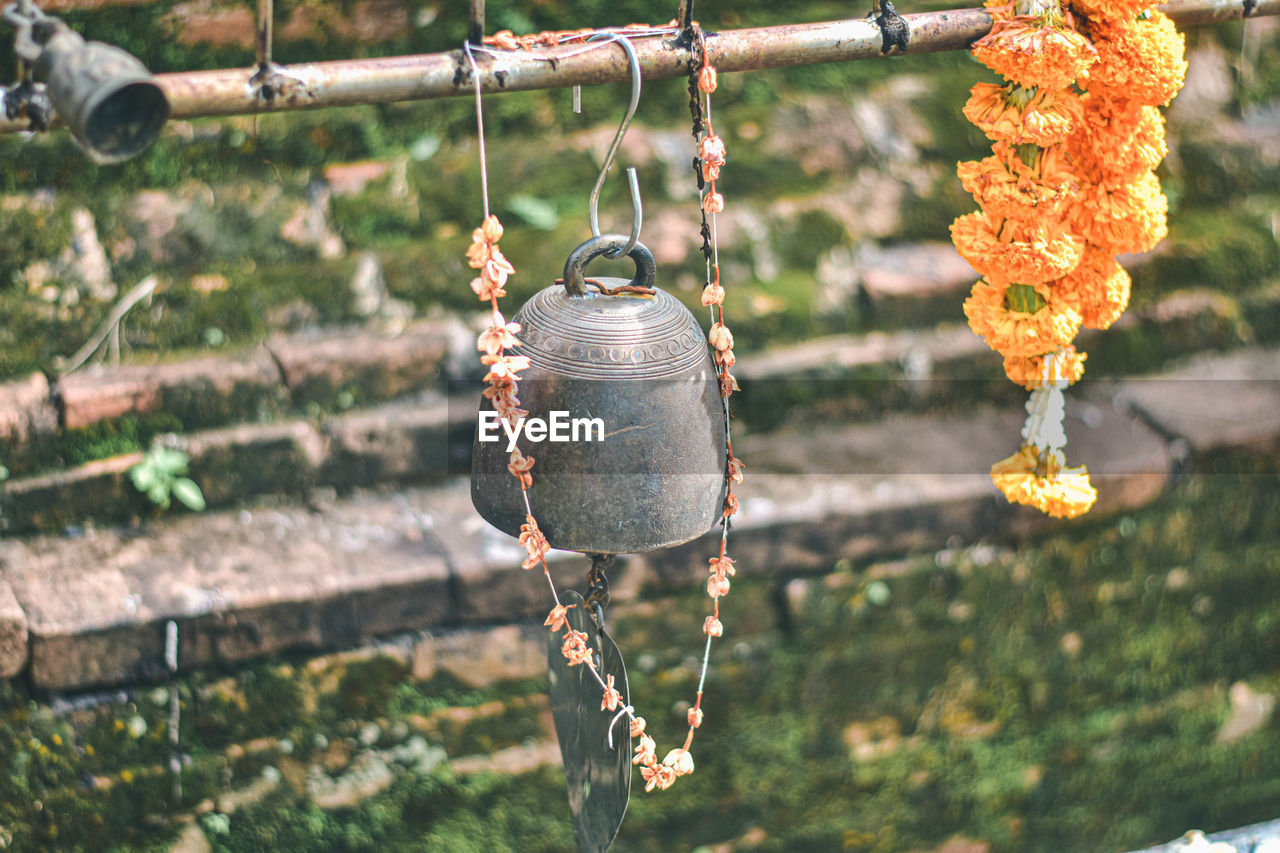 close-up of decoration hanging on rope