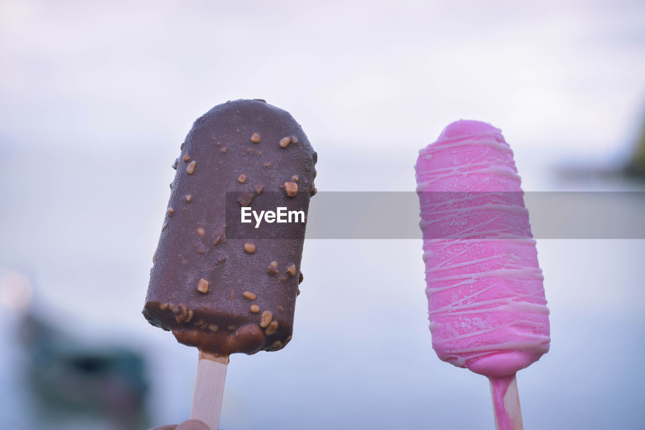 Close-up of ice creams against sky