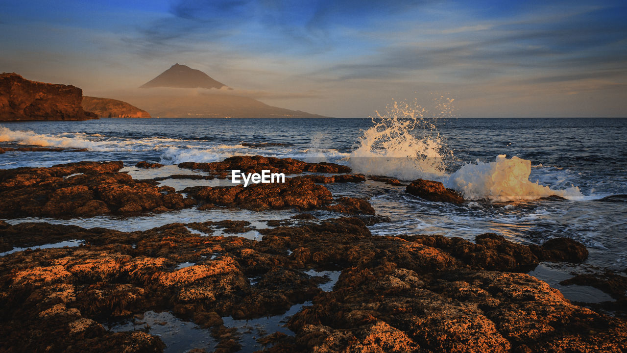 Scenic view of sea against sky during sunset