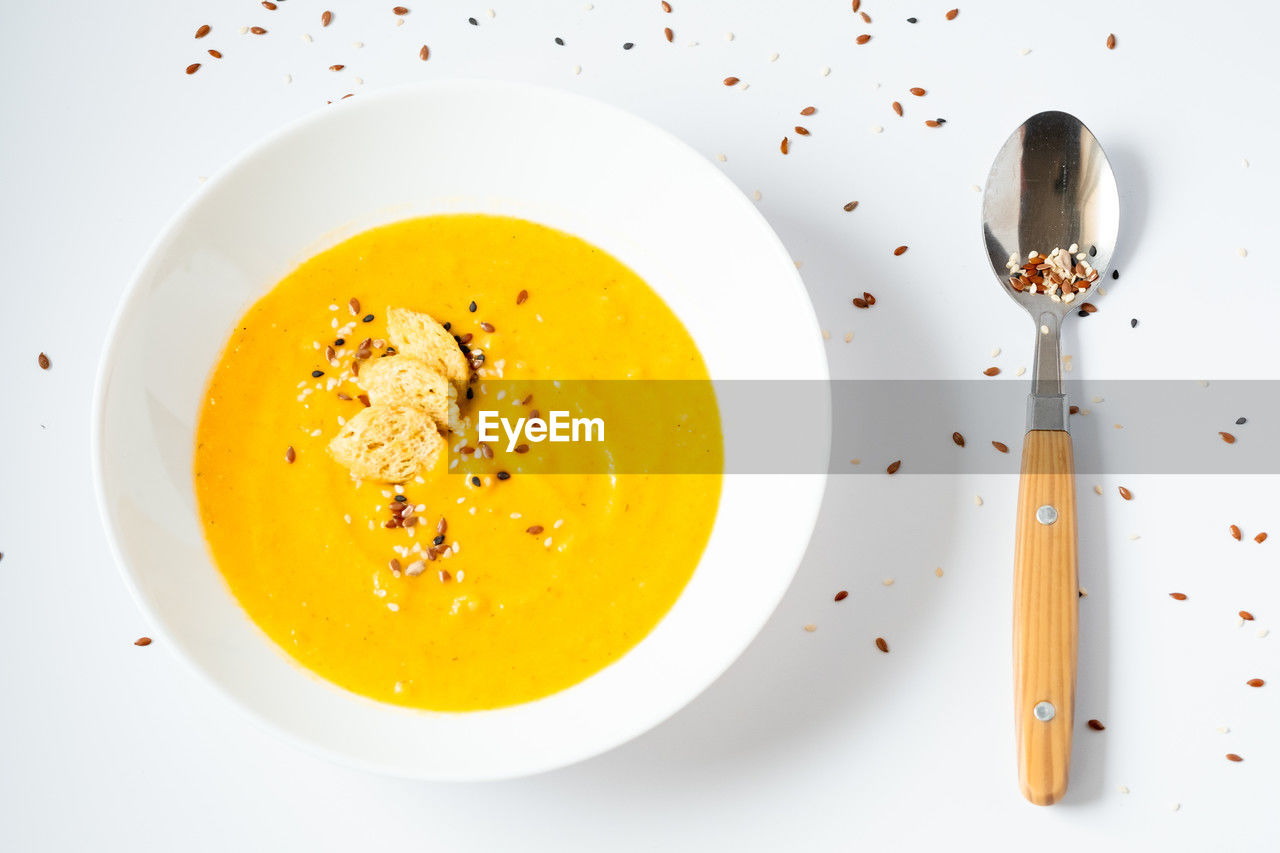 food and drink, food, healthy eating, kitchen utensil, dish, yellow, produce, freshness, eating utensil, meal, no people, directly above, wellbeing, plate, seasoning, indoors, bisque, vegetable, spice, egg