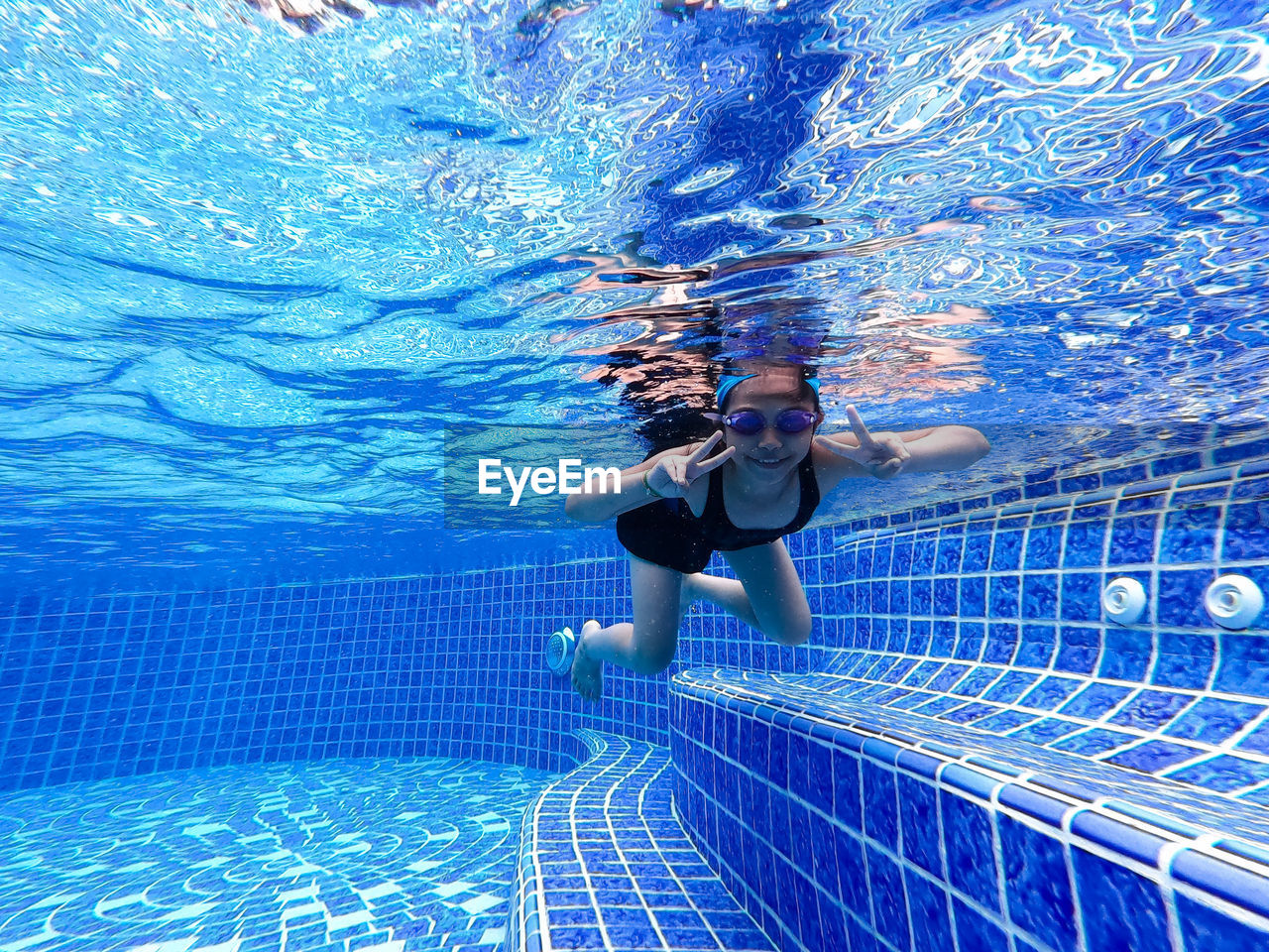 Portrait of girl swimming in pool