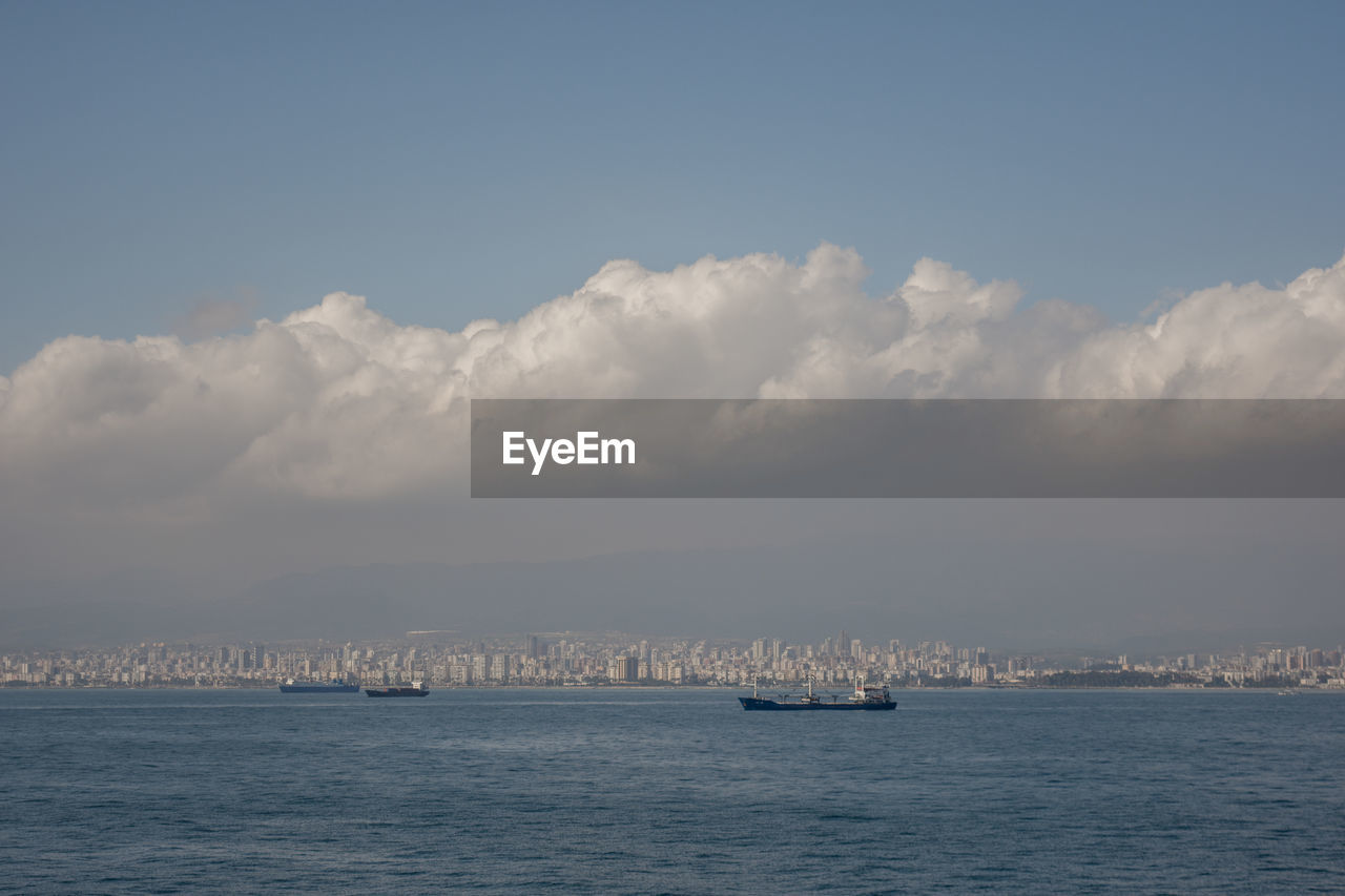 Sailboats on sea against sky