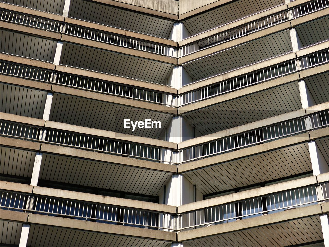 Facade of a building with a lot of balconies. it seems like a lost place. 