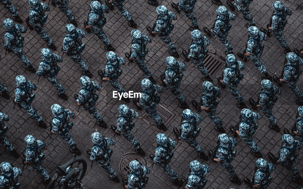 High angle view of soldiers walking on street