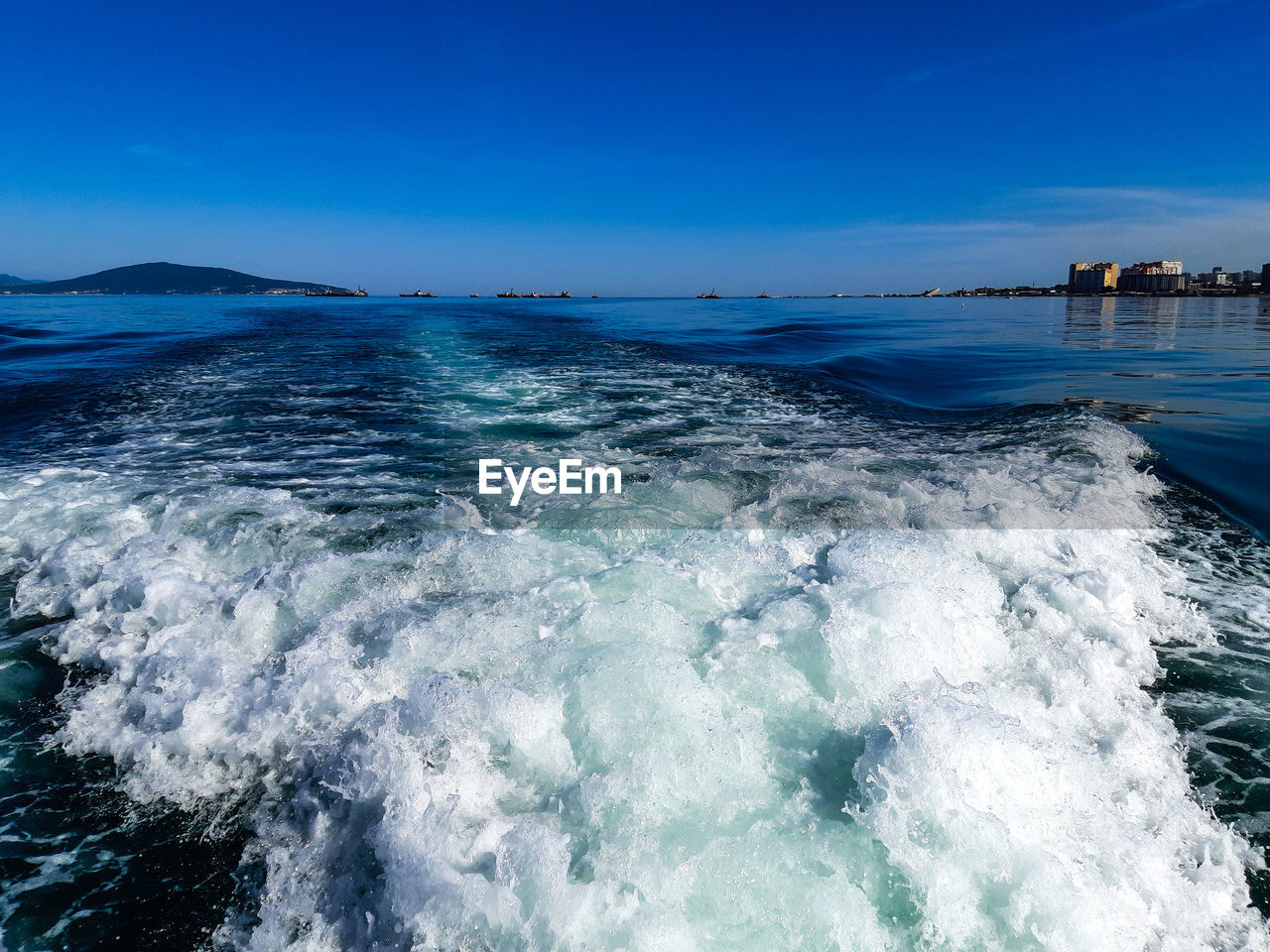 Scenic view of sea against blue sky