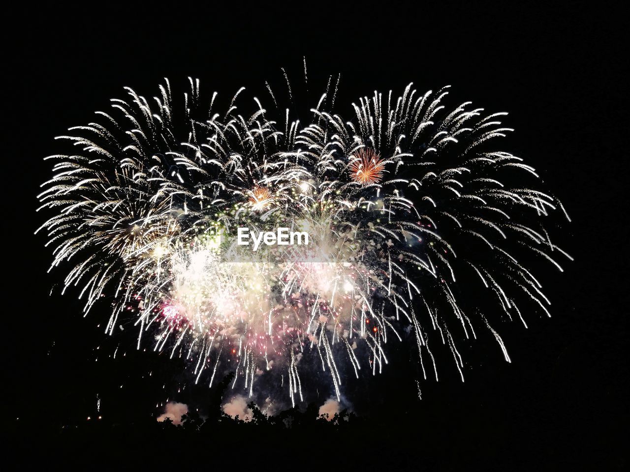 LOW ANGLE VIEW OF FIREWORK DISPLAY