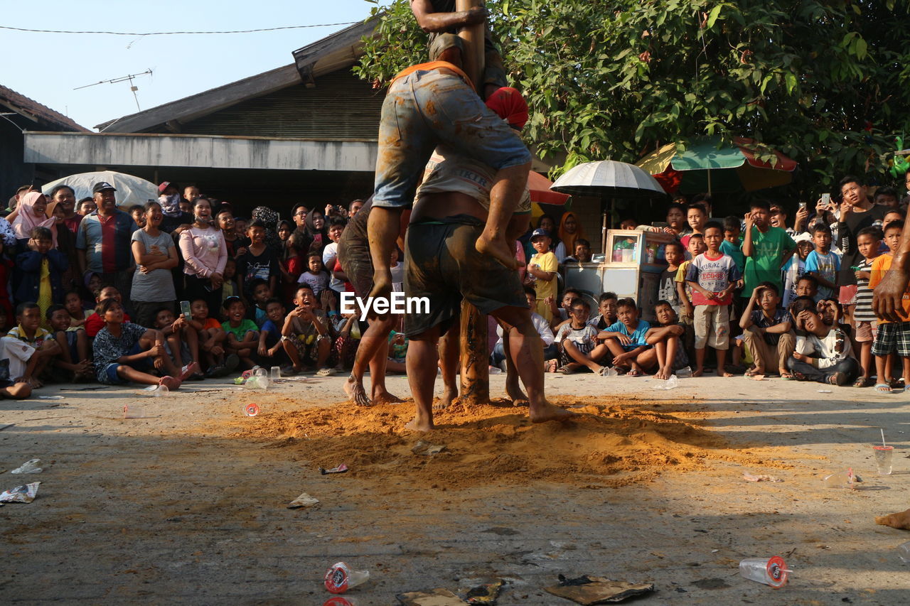 GROUP OF PEOPLE IN STREET