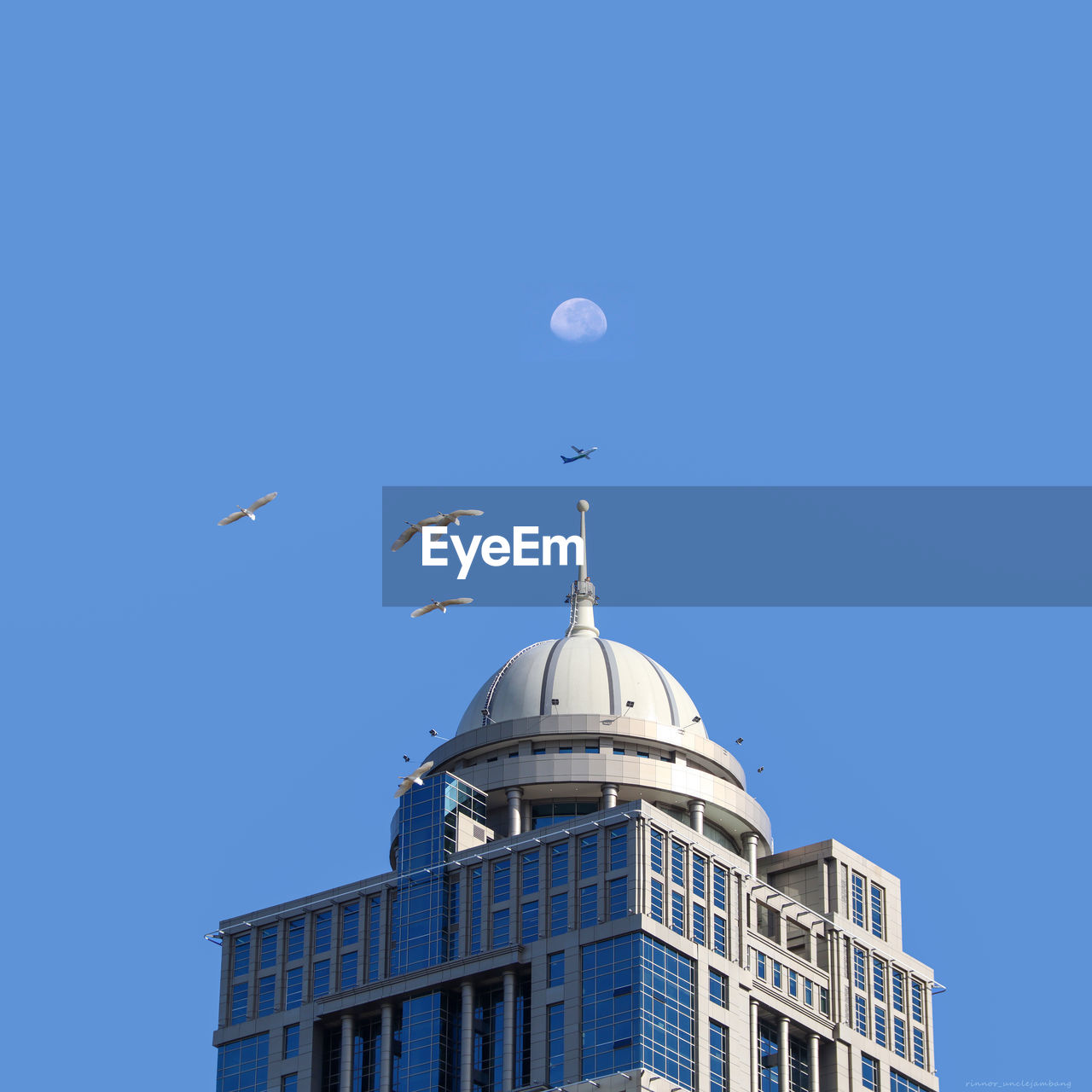 Low angle view of building against clear blue sky