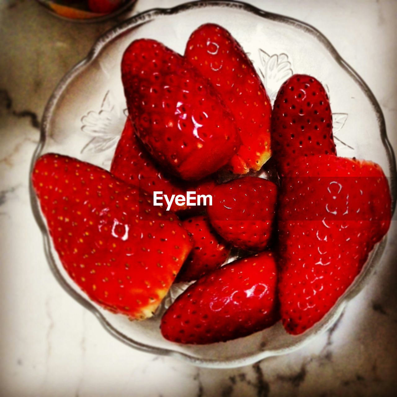 High angle view of bowl of strawberries