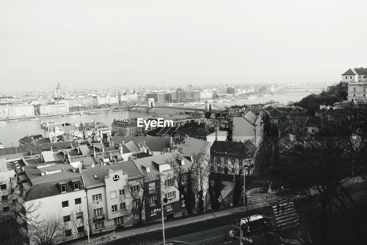 HIGH ANGLE SHOT OF BUILDINGS AGAINST SKY