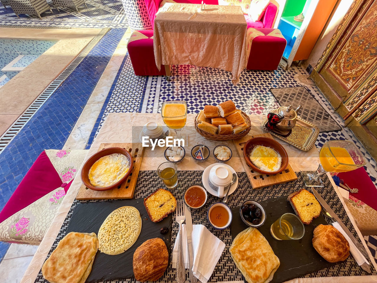 food and drink, food, high angle view, table, snack, no people, fast food, meal, freshness, dessert, variation, still life, bread, drink, indoors, baked, large group of objects, healthy eating, business, day, sweet food, breakfast