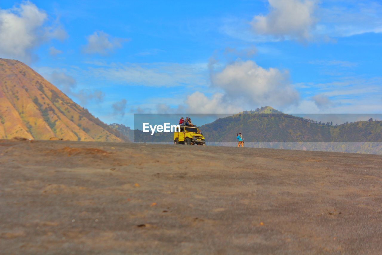 SCENIC VIEW OF LAND ON MOUNTAIN AGAINST SKY