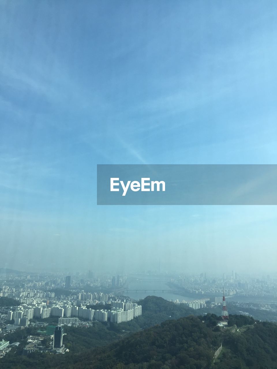 AERIAL VIEW OF CITYSCAPE AGAINST SKY