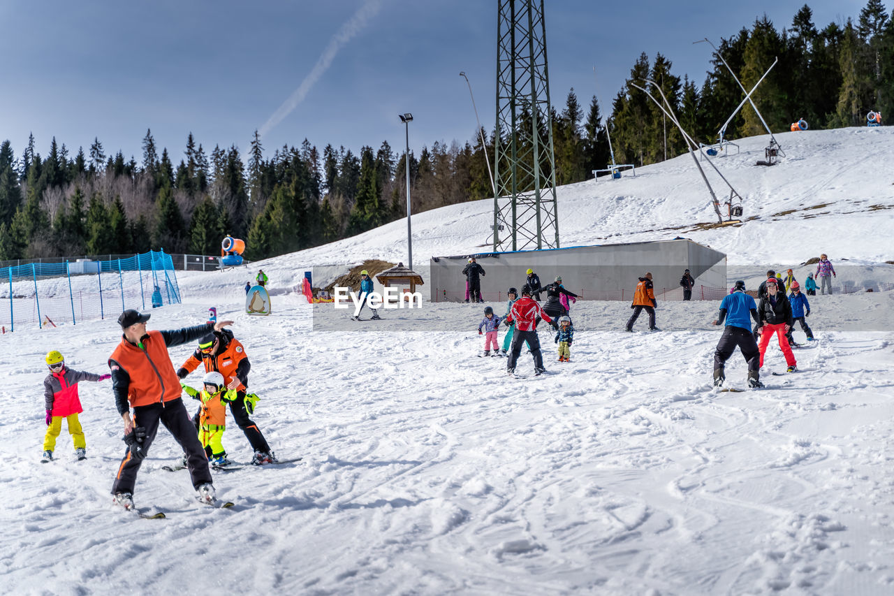 GROUP OF PEOPLE IN SNOW