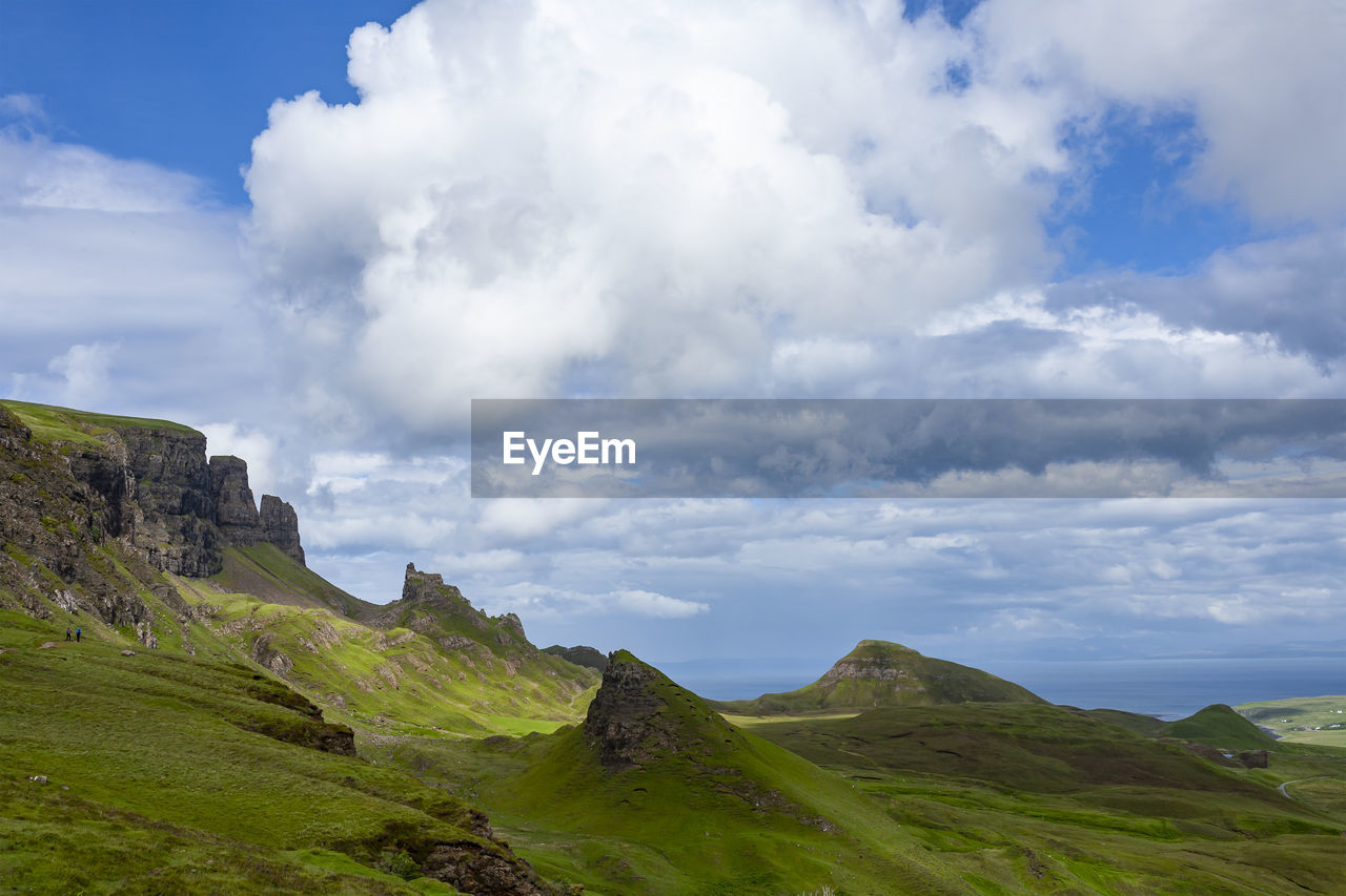 Green fields and blue sky with clouds in quiraing isle of skye scotlan