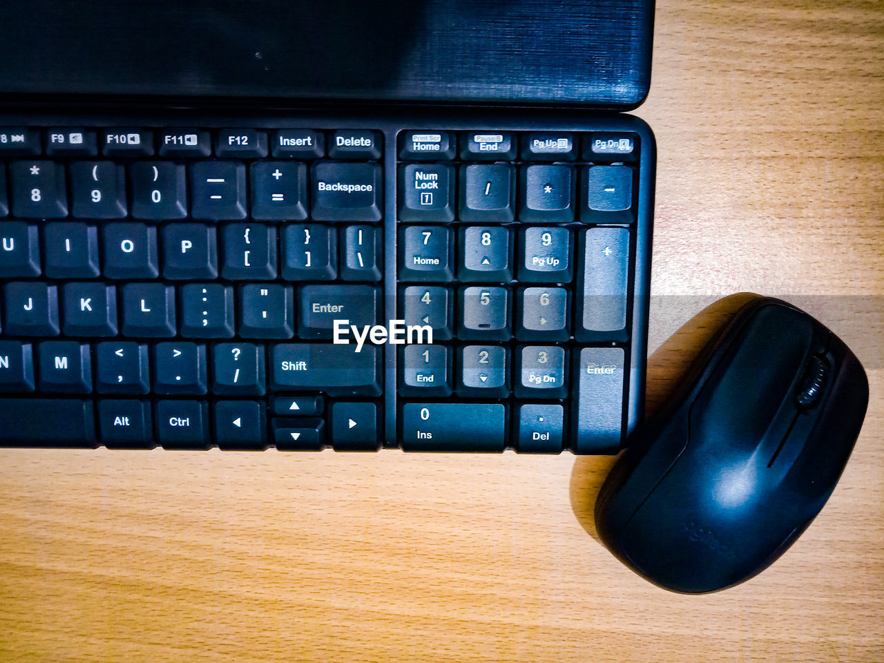 Directly above shot of computer keyboard with computer mouse