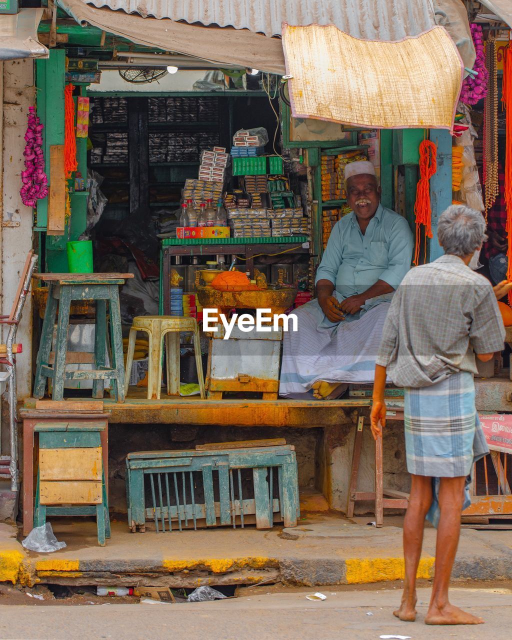 PORTRAIT OF FRIENDS STANDING AT MARKET