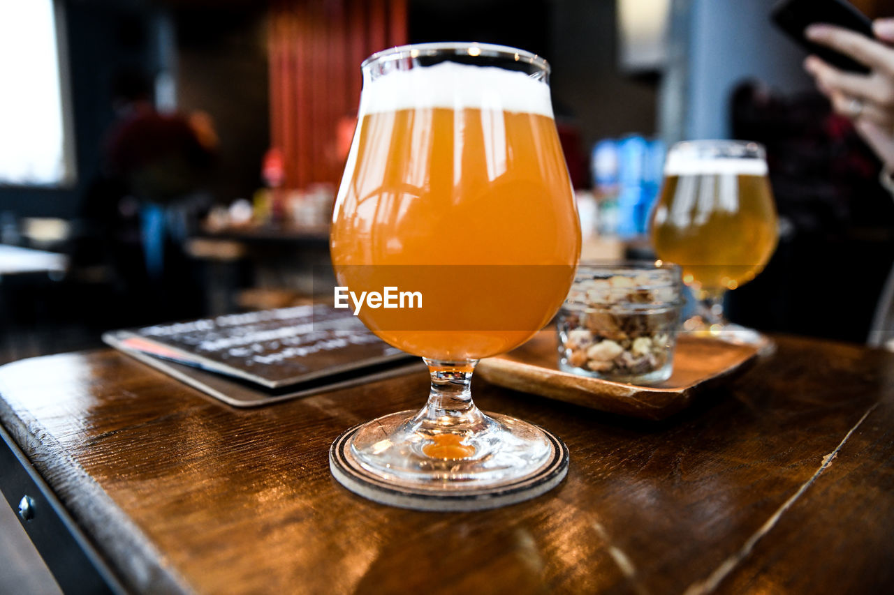 Close-up of beer glass on table