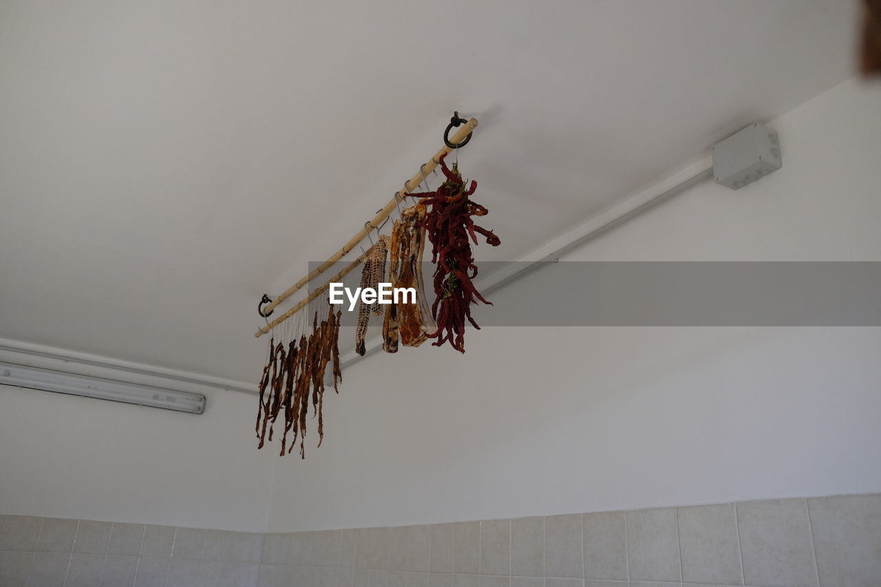 Low angle view of dried meat hanging on ceiling