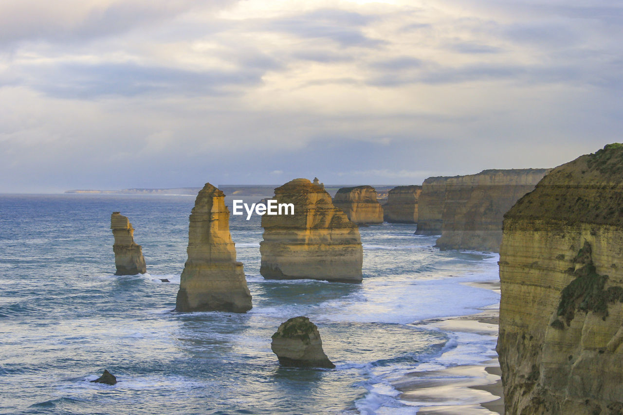 Scenic view of the twelve apostles against cloudy sky