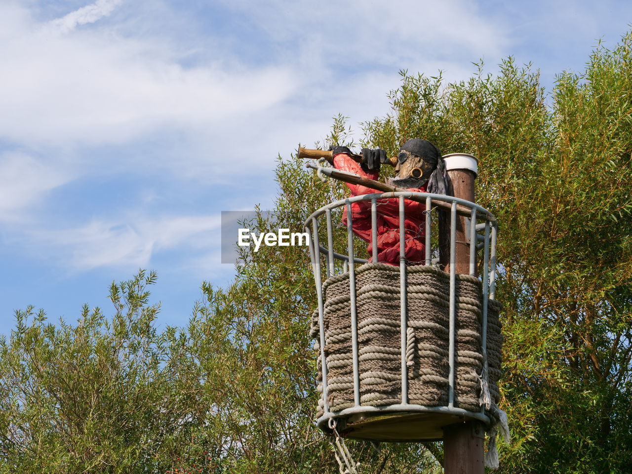 LOW ANGLE VIEW OF TRADITIONAL WINDMILL AGAINST SKY