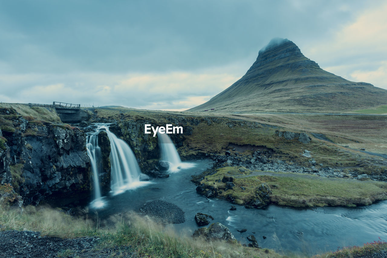 VIEW OF WATERFALL AGAINST SKY