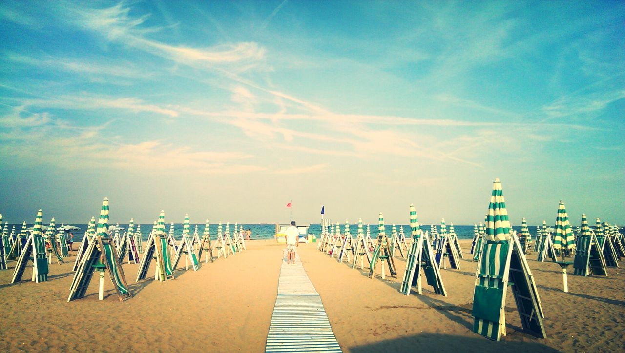 Lounge chair with umbrella at beach