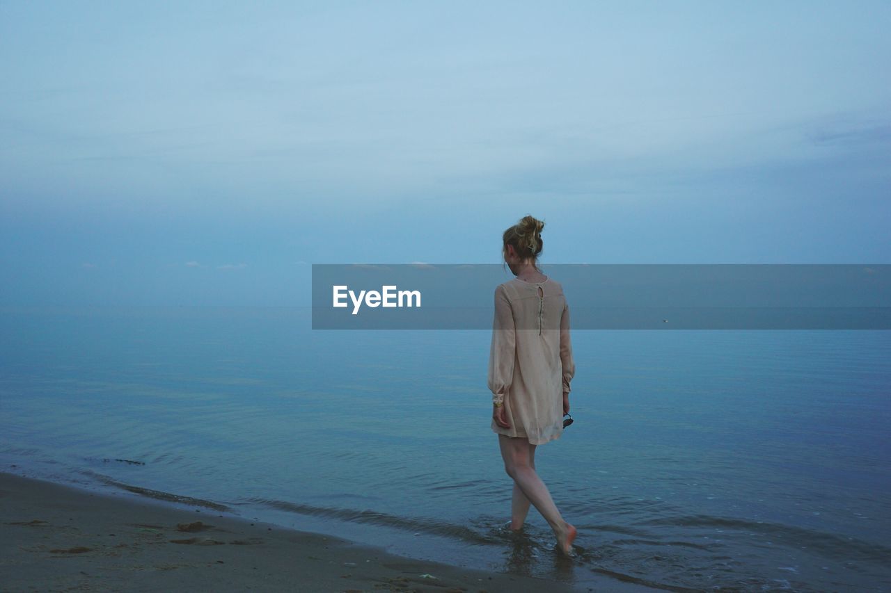 Woman walking on beach