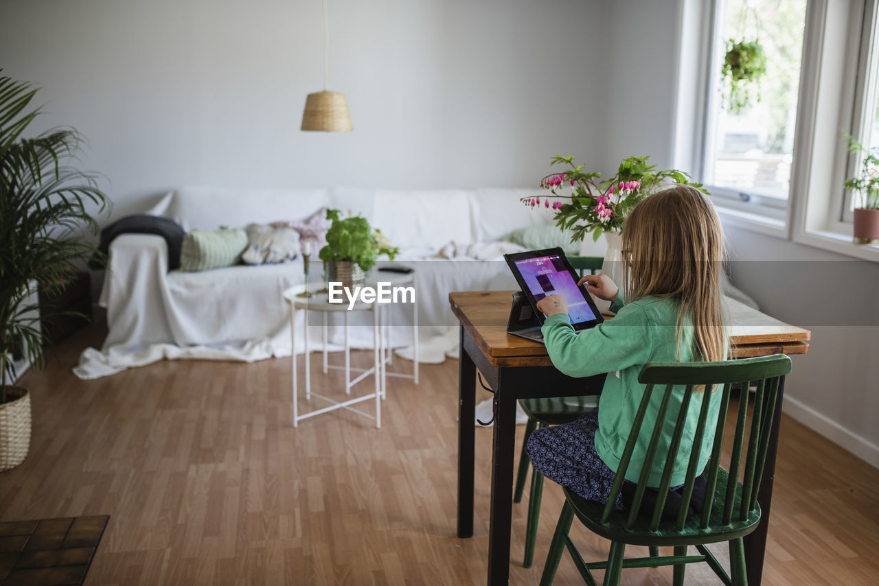 Girl using digital tablet