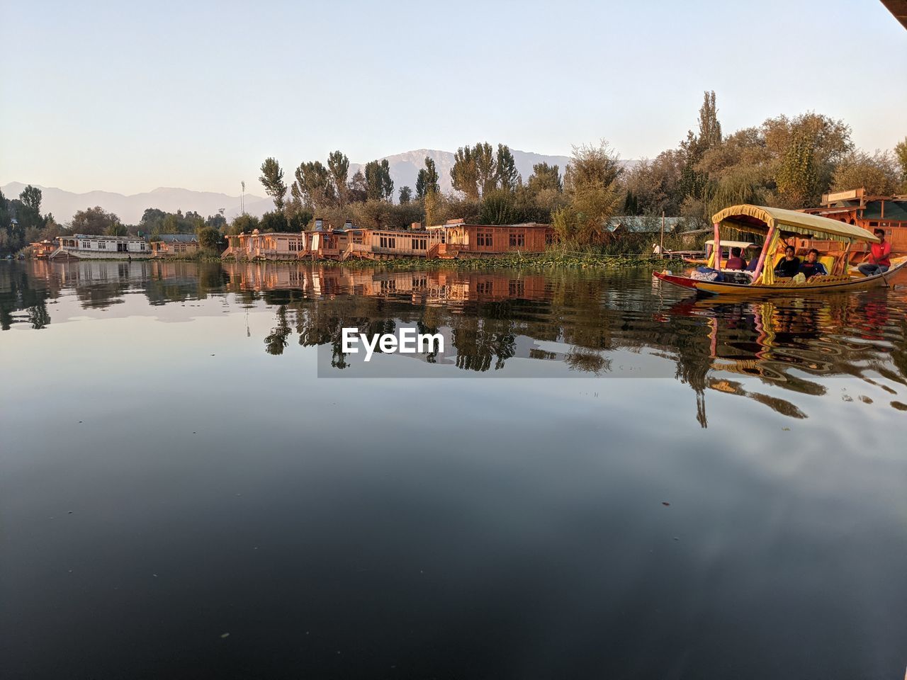 SCENIC VIEW OF LAKE AGAINST BUILDINGS