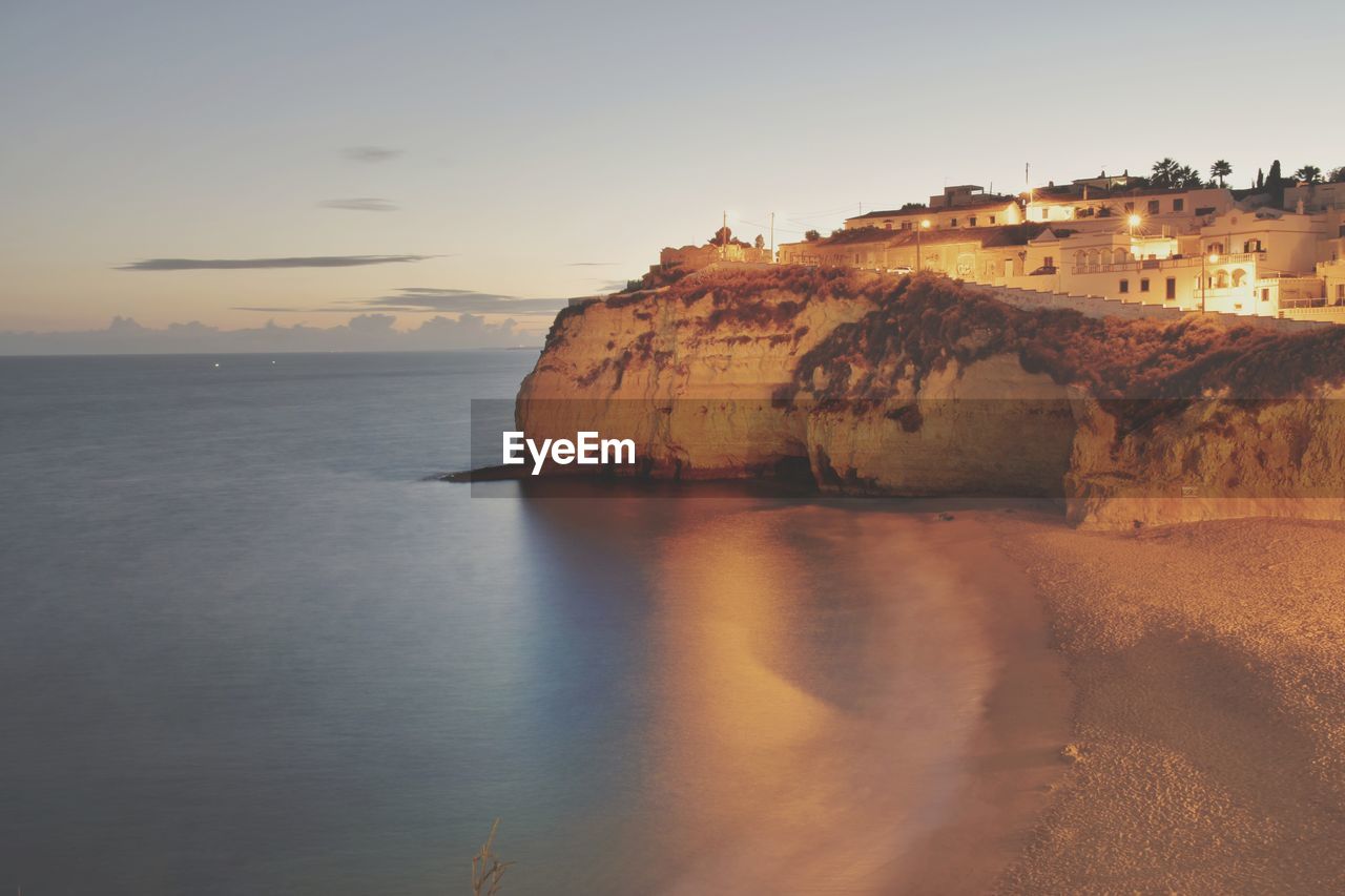 VIEW OF BEACH AT SUNSET