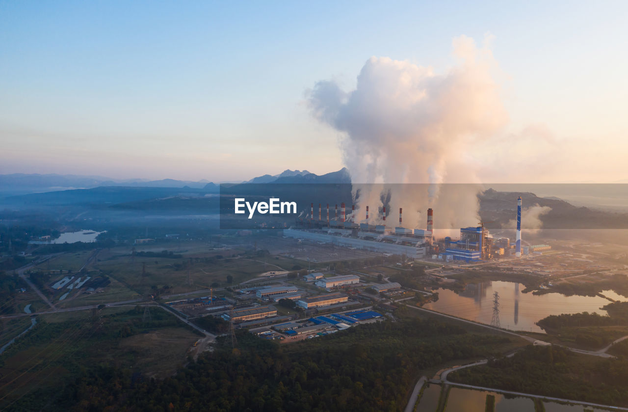 High angle view of smoke emitting from factory against sky. coal power plant.