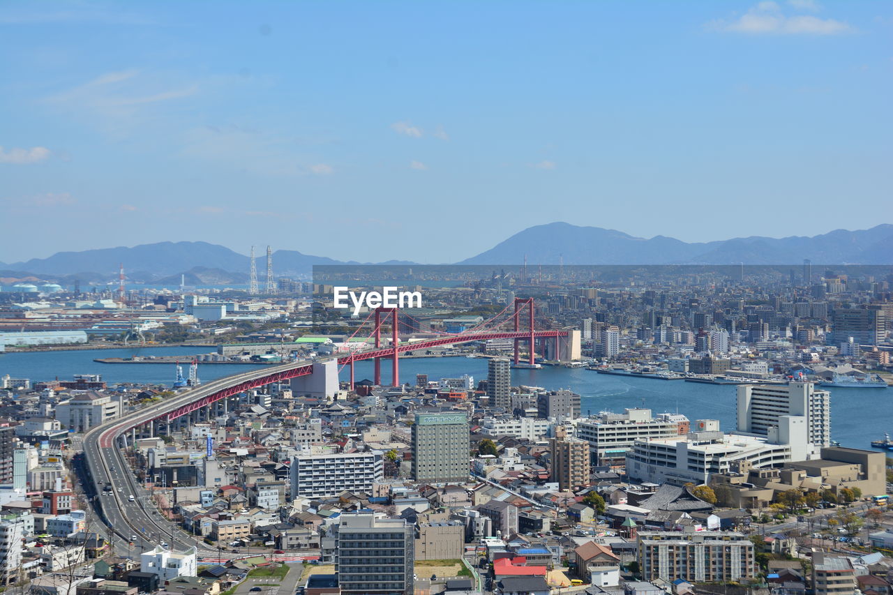 High angle view of city buildings against sky