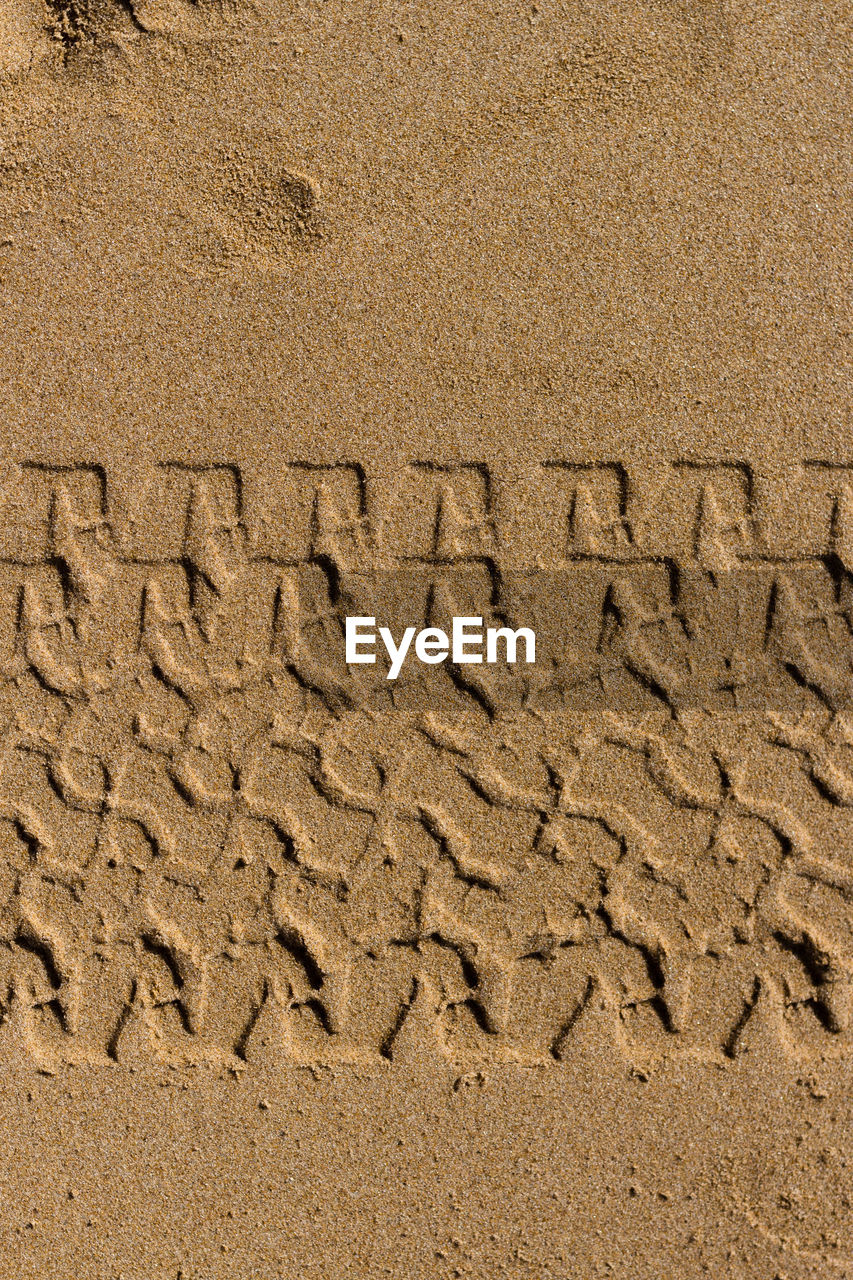 CLOSE-UP OF SAND ON BEACH