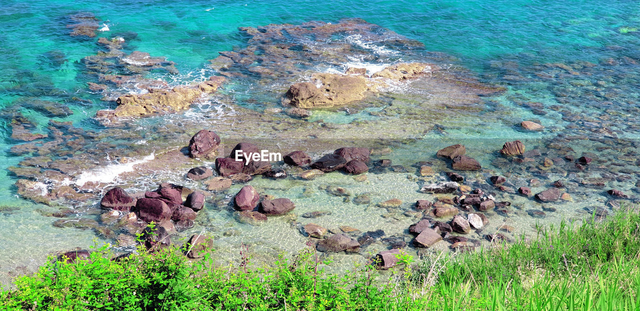 Stones and rocks in the mediterranea sea. italy