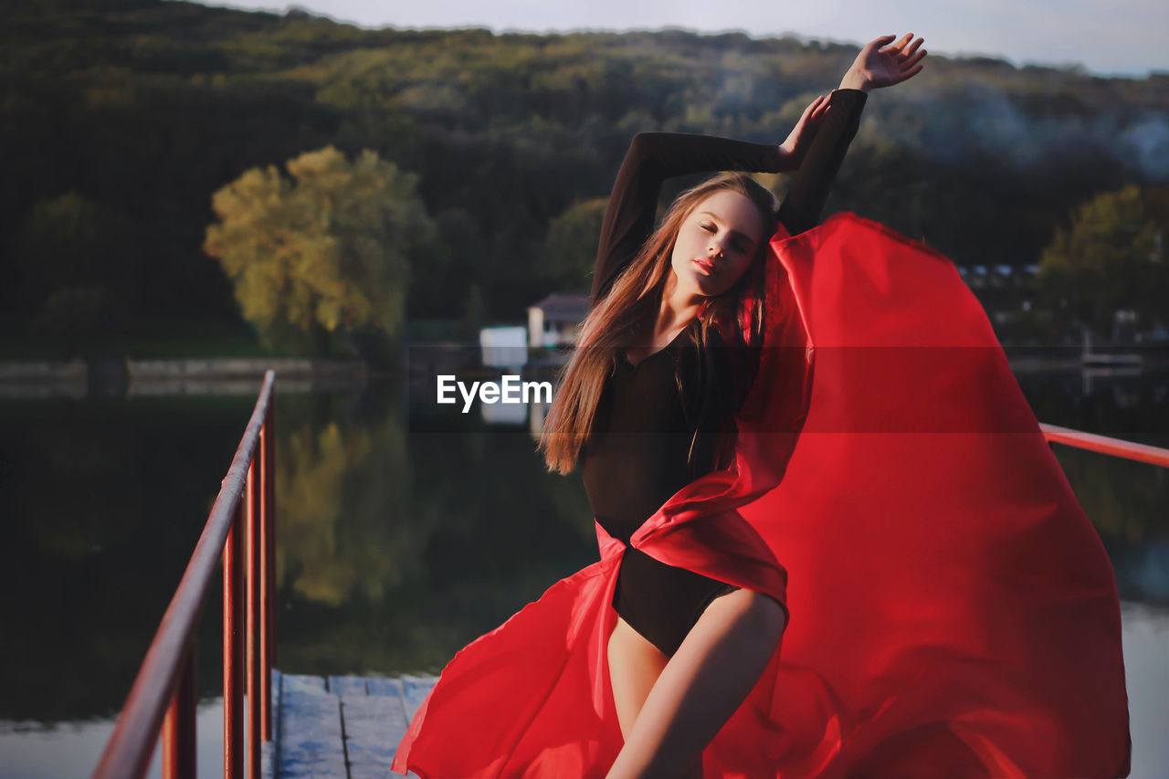 Female fashion model standing outdoors