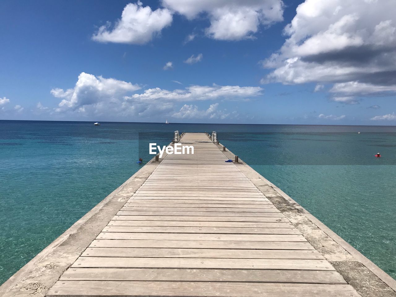 Pier over sea against sky