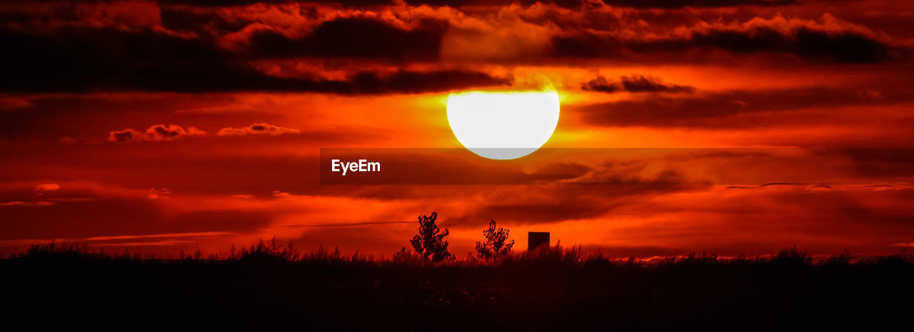 SILHOUETTE LANDSCAPE AGAINST SKY DURING SUNSET