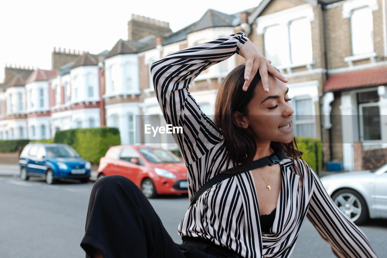 Young woman on street in city